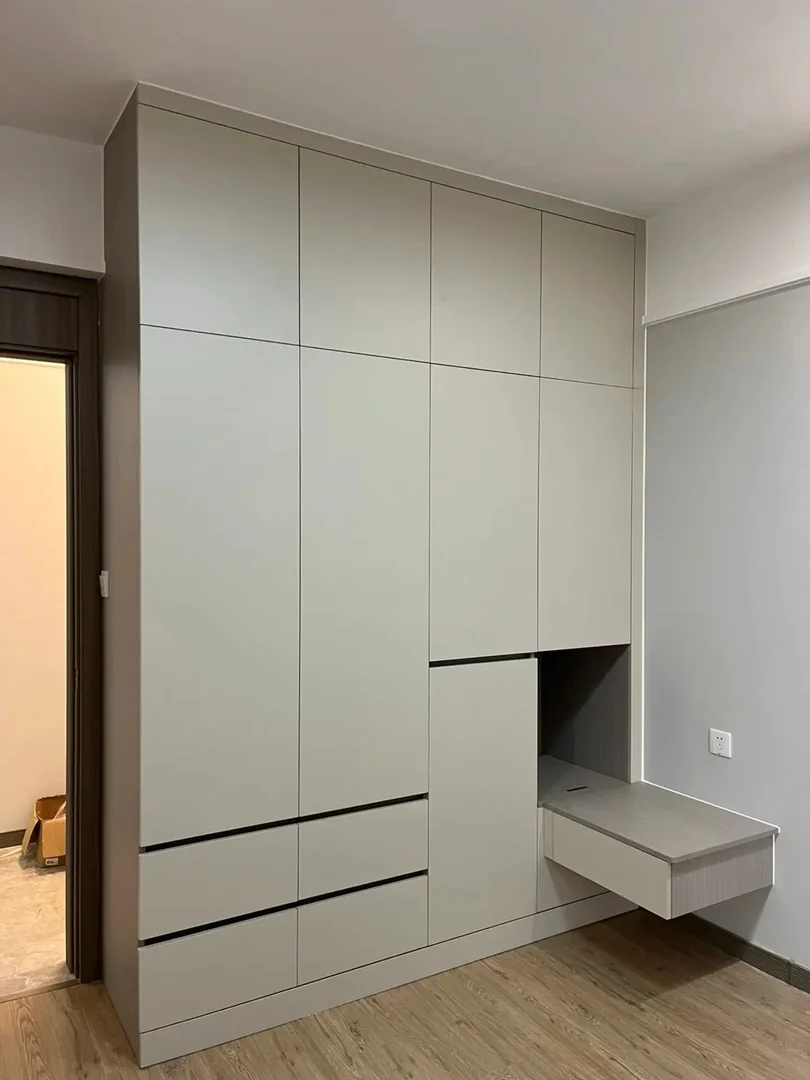 Custom bedroom wardrobe with bedside storage in a Singapore HDB room