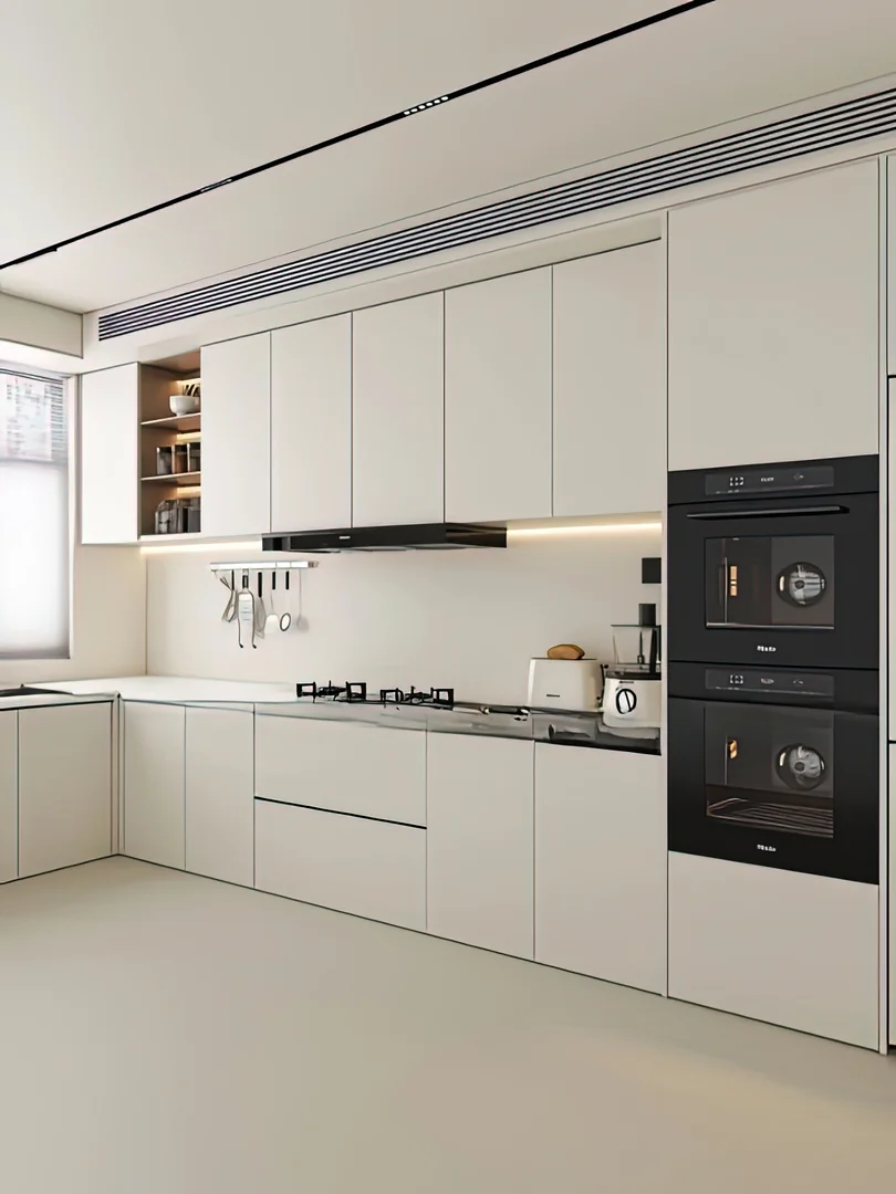 White kitchen cabinets with black built-in ovens, hob and cooker hood in a Singapore home